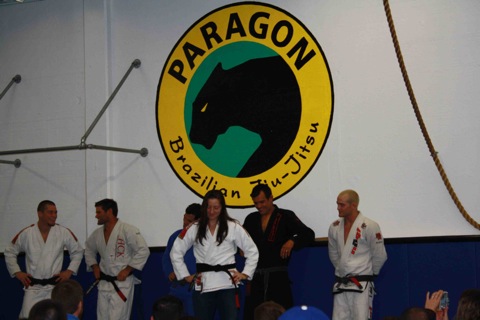 Bill Cooper speaks to new black belts, Sean Apperson, while Katrina shows her new belt to Franjinha, Jeff Glover and the whole team at the Santa Barbara academy. Photo: Publicity.