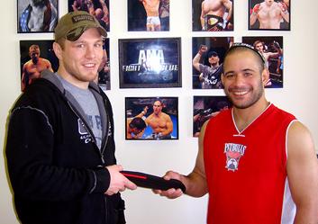 Miller receives new belt. Photo: AMA Fight Club