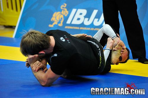 AJ attacks with a foot lock. Photo: GRACIEMAG 