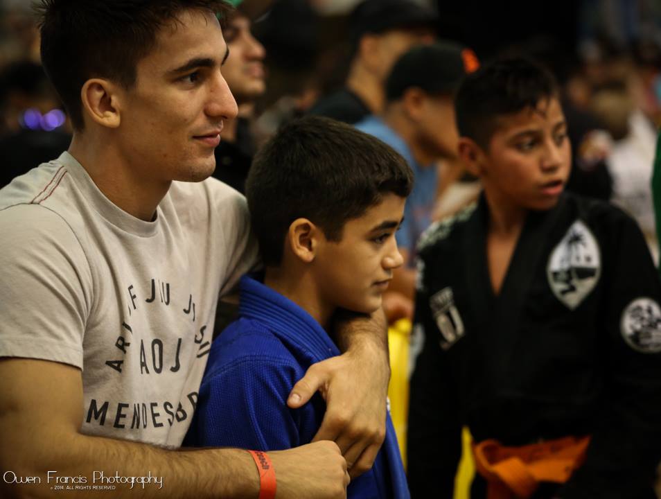 Guilherme with a student. Photo: Owen Francis Photography