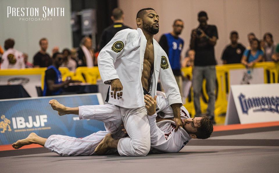 Tim Spriggs mounts his opponent in black belt debut. Photo: Preston Smith