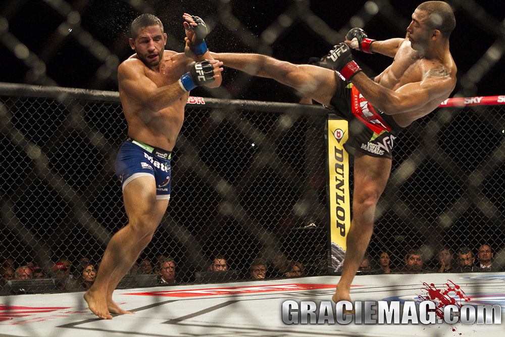 Jose Aldo tries a high kick against Chad Mendes at UFC 179