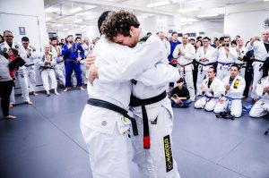 Jon receiving his black belt. Photo: John "Ric" Ricard