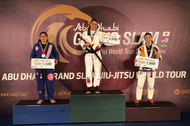 Marina Ribeiro at the top of the female black/brown belt open class podium