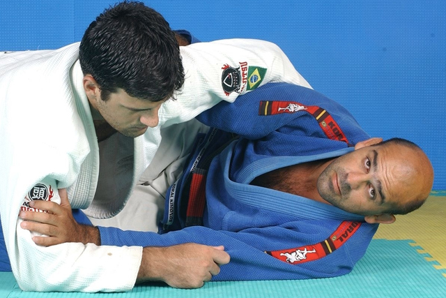 Roberto “Gordo” Correa teaches a sweep from half-guard landing with the guard passed